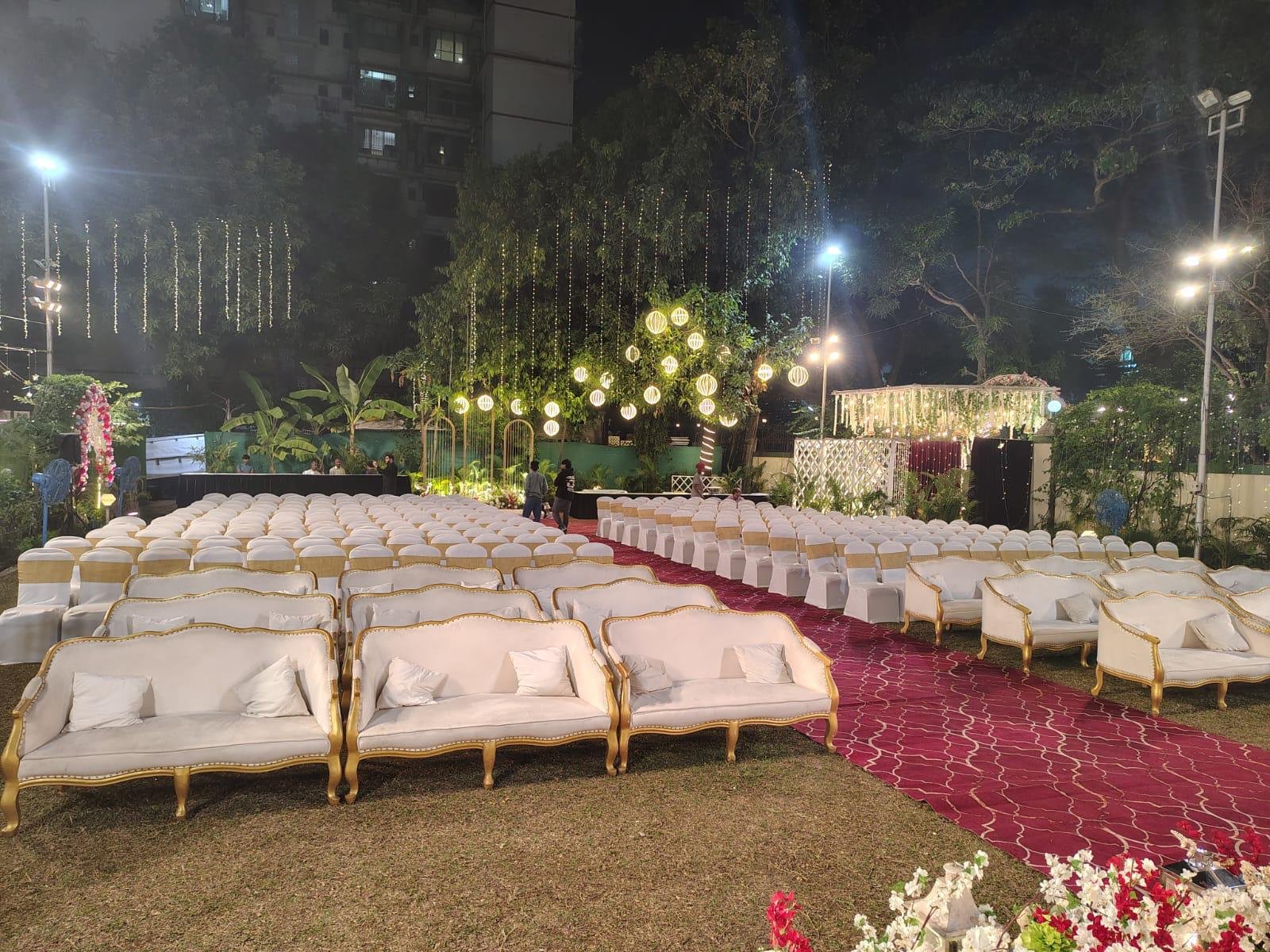 Night outdoor lawn seating with comfortable white sofas